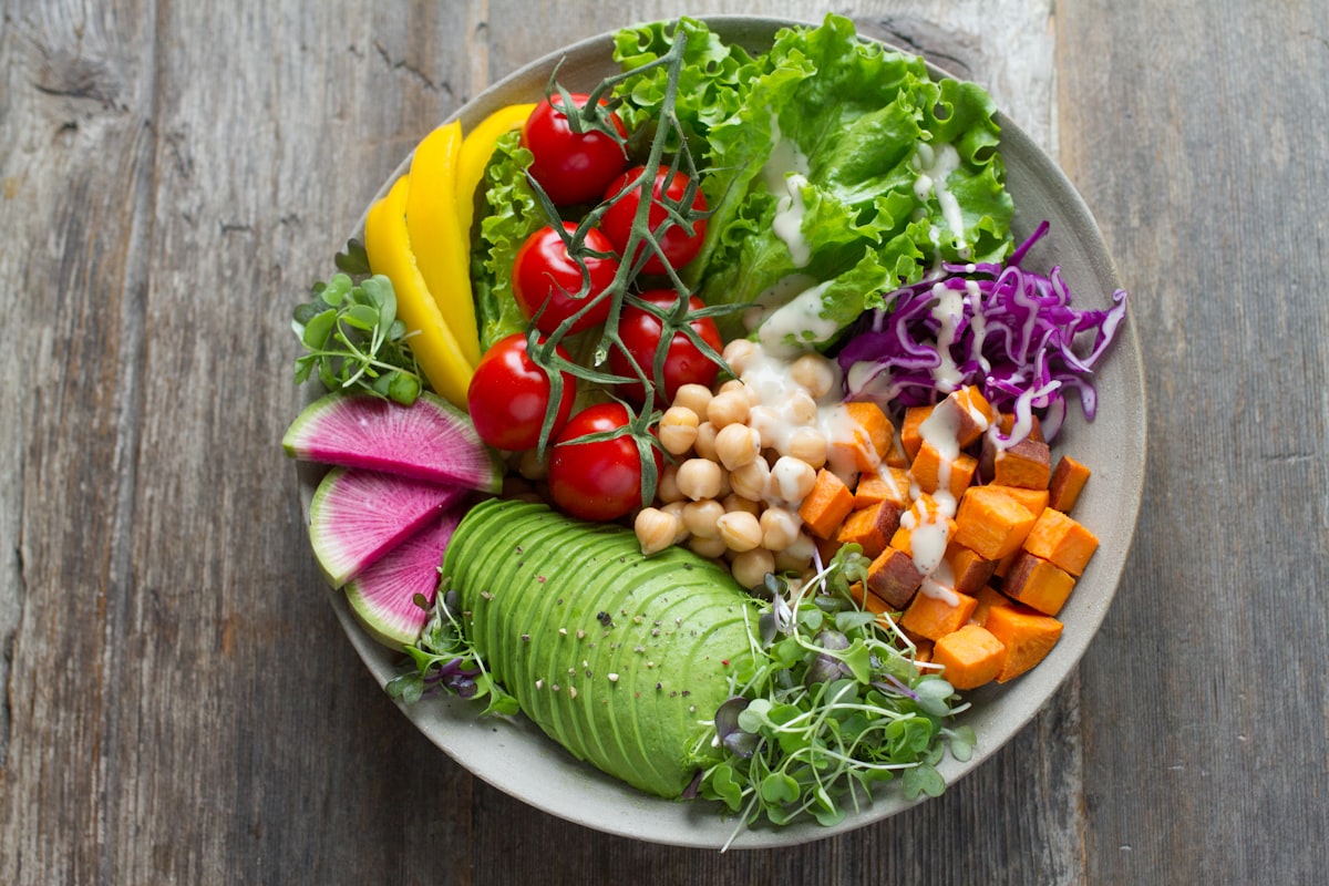An avocado and sweet potato bowl photographed from above, mid-scan
